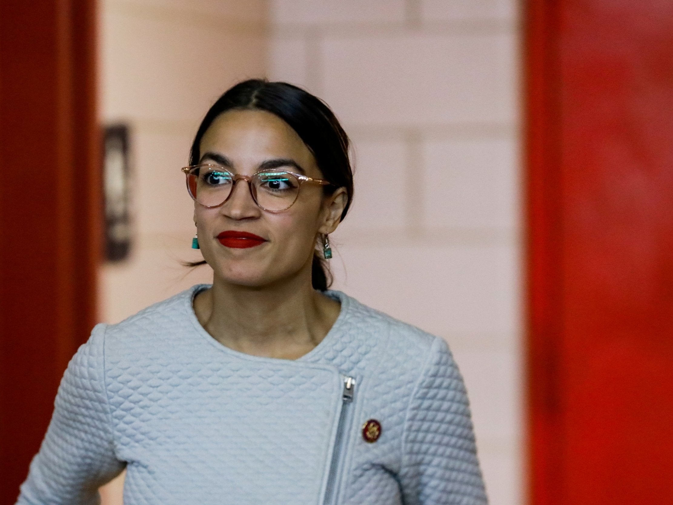 Alexandria Ocasio-Cortez arrives at a town hall meeting in the Queens borough of New York City, 27 April