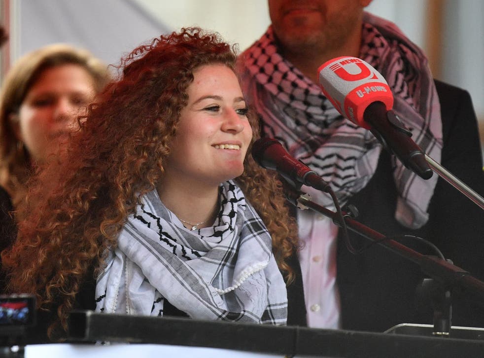 Palestinian activist Ahed Tamimi speaks at a rally calling for justice for Palestinians amid a growing threat of further war in the Middle East in central London on 11 May 2019