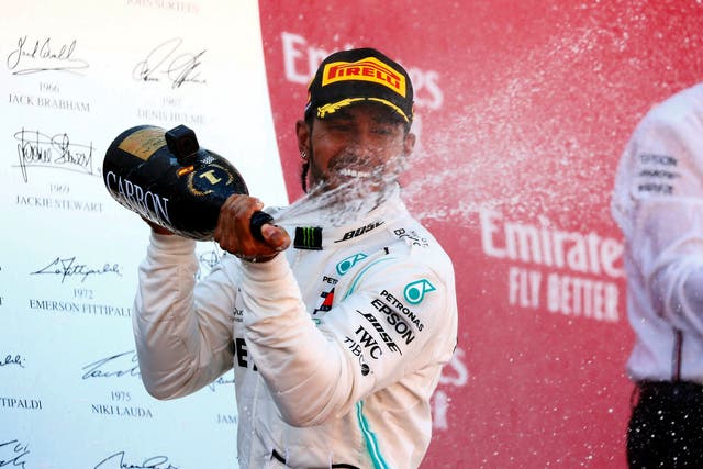Lewis Hamilton celebrates on the podium in Barcelona