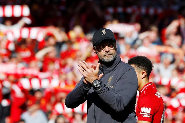 Jurgen Klopp applauds the Liverpool fans at full-time