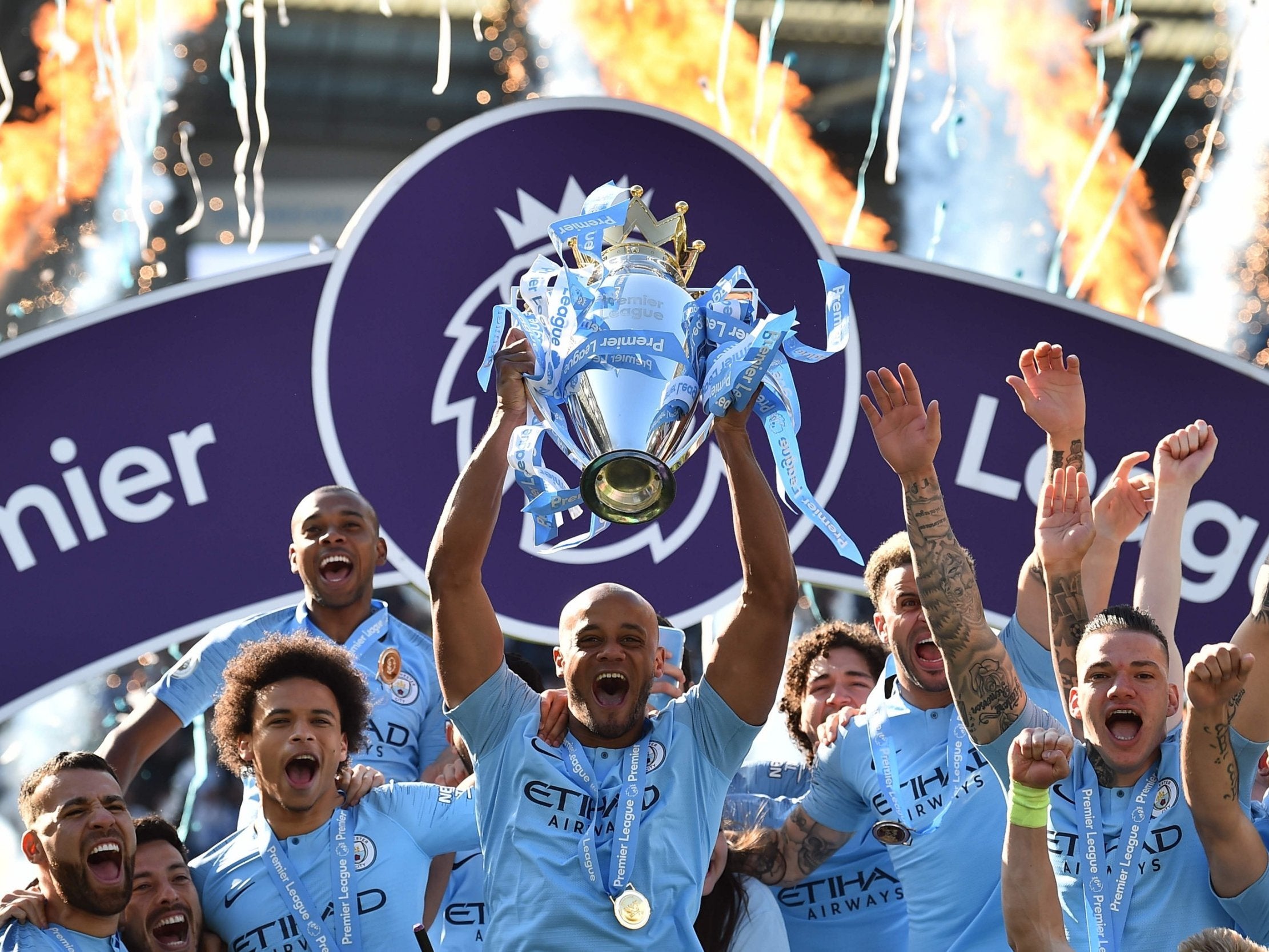 Vincent Kompany lifts the trophy