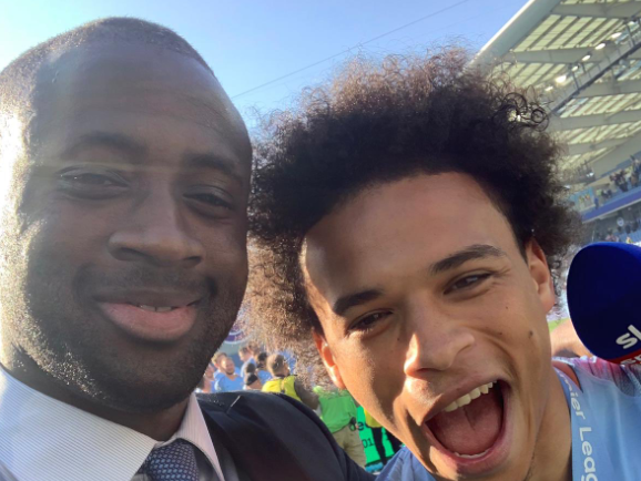 Yaya Toure with Leroy Sane after City win the title at Brighton