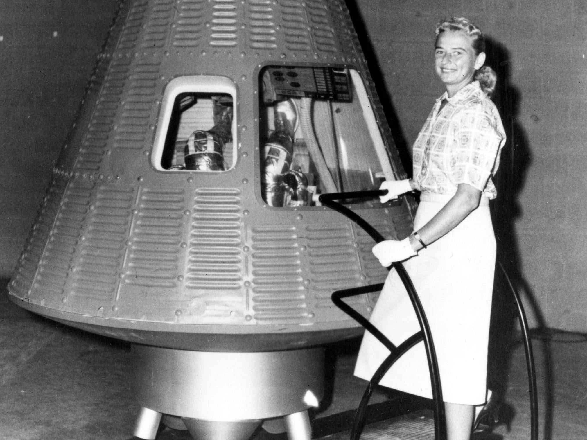 We have liftoff: Cobb next to a Mercury spaceship capsule