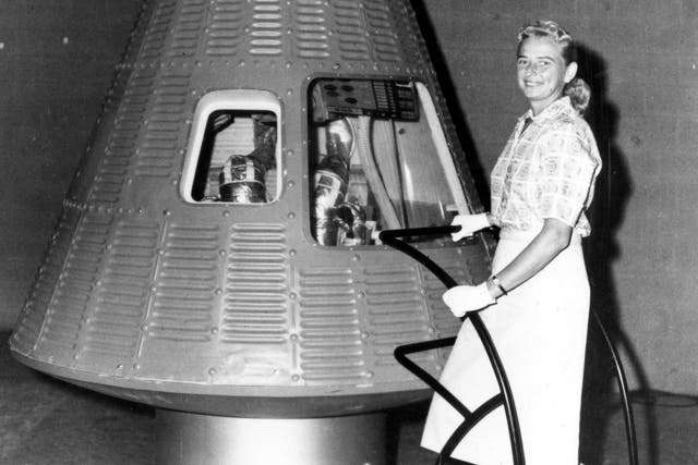 We have liftoff: Cobb next to a Mercury spaceship capsule