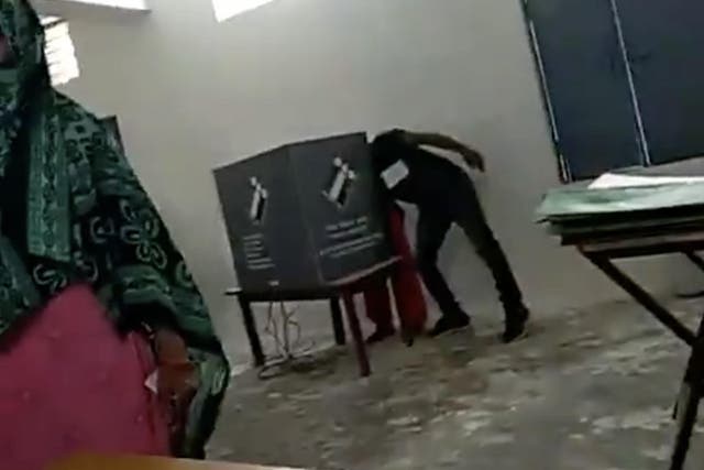 Video purports to show a polling agent interfering as women go to vote in Faridabad, Haryana