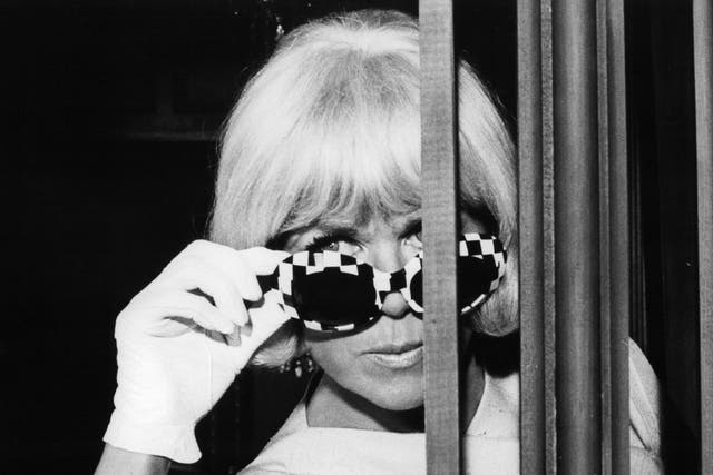 The Hollywood star adjusts her sunglasses in ‘Caprice’, 1967