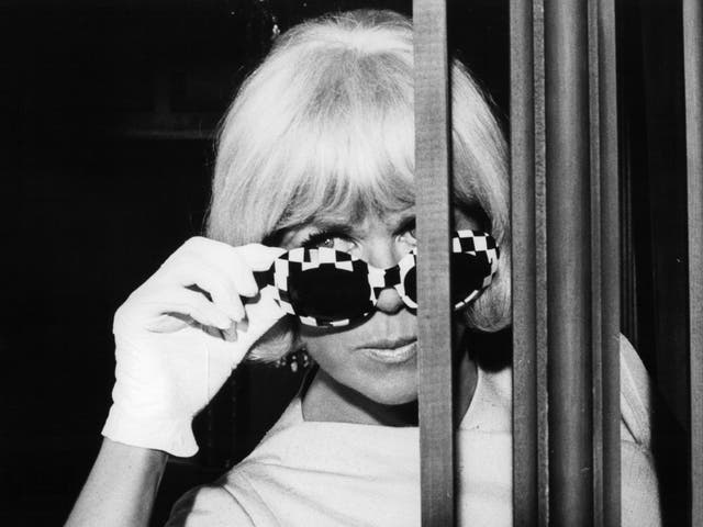The Hollywood star adjusts her sunglasses in ‘Caprice’, 1967