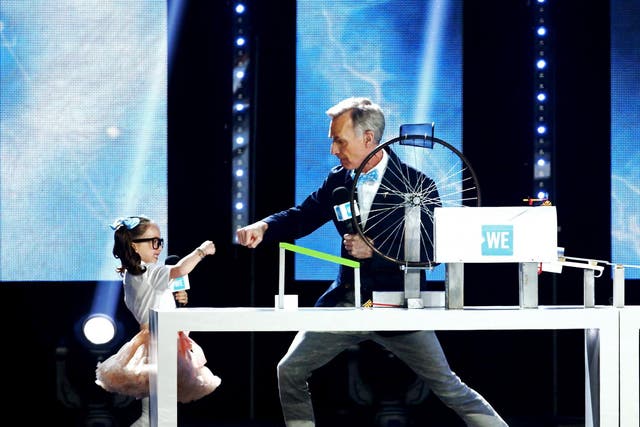 Bill Nye (right) and Brielle Milla (left)  speak onstage at WE Day California at The Forum on April 25, 2019 in Inglewood, California.