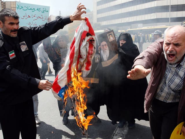 Demonstrators burn US flag during an anti-US rally, to show their support of Iran's decision to pull out from some part of nuclear deal, in Tehran, Iran, 10 May 2019. Media reported that on 08 May 2019 that President Hassan Rouhani announced Iran's decision to pull out from part of a 2015 international nuclear deal, a year after US President Trump pulled out of the agreement.