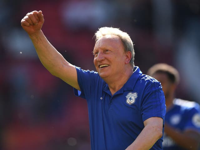 Cardiff manager Neil Warnock celebrates with the fans