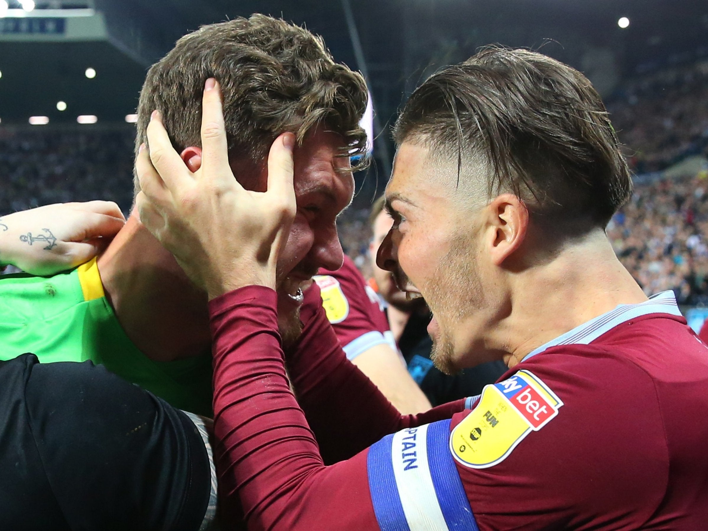 Jed Steer celebrates with Aston Villa captain Jack Grealish after beating West Brom