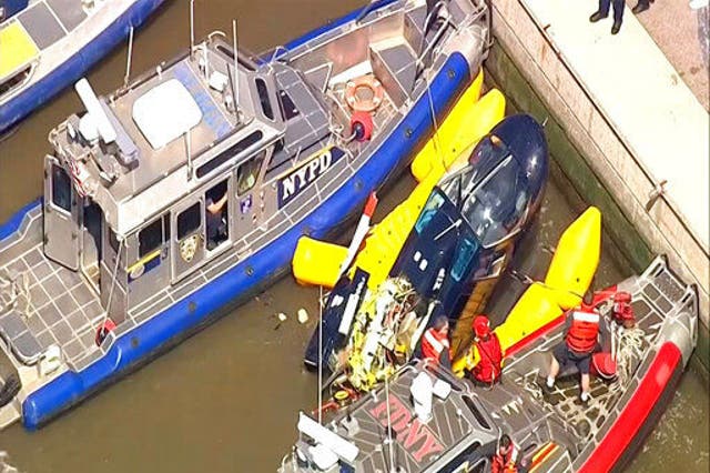Harbour units from the New York City police and fire departments secured the helicopter after it crashed