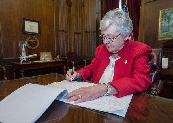 Alabama governor signs law banning almost all abortions, in US's strictest bill