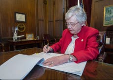 Alabama governor signs law banning almost all abortions