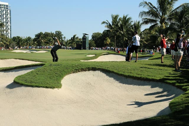 Dustin Johnson takes his shot on the sixth hole during the final round of the World Golf Championships-Cadillac Championship at Trump National Doral Blue Monster Course, on 6 March 2016 in Doral, Florida.