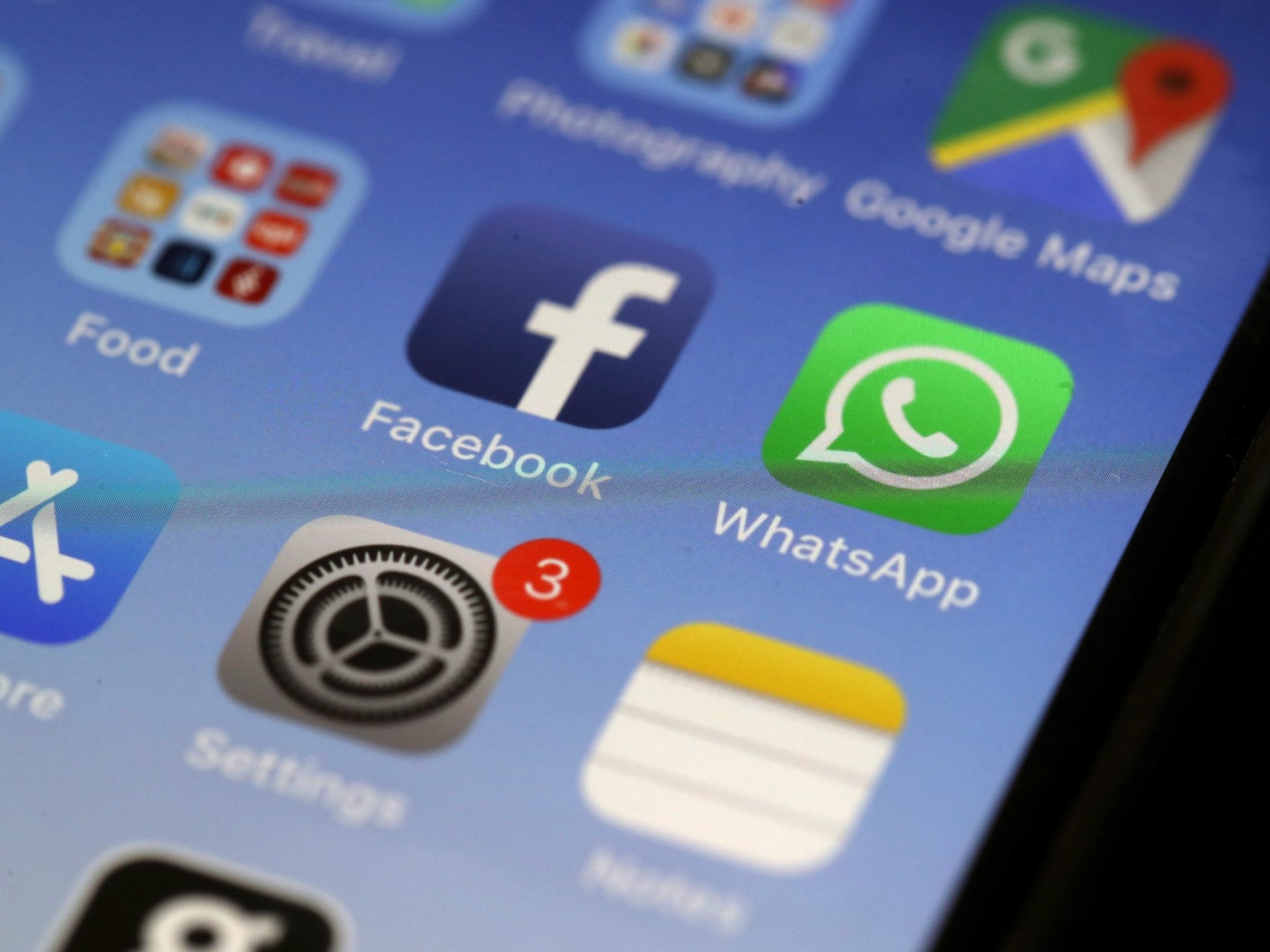 The WhatsApp messaging app is displayed on an Apple iPhone
