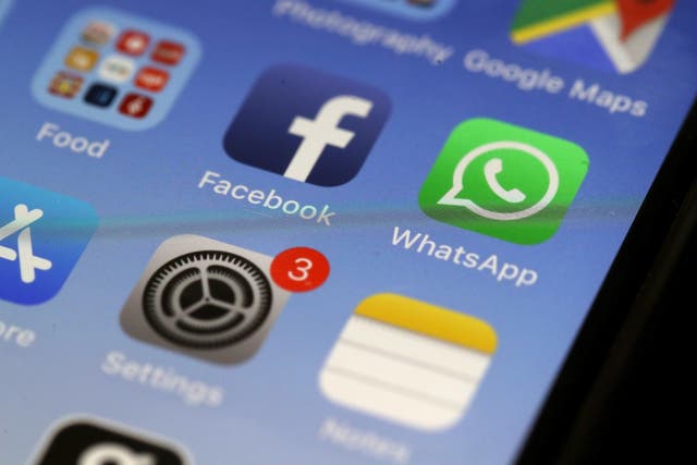 The WhatsApp messaging app is displayed on an Apple iPhone