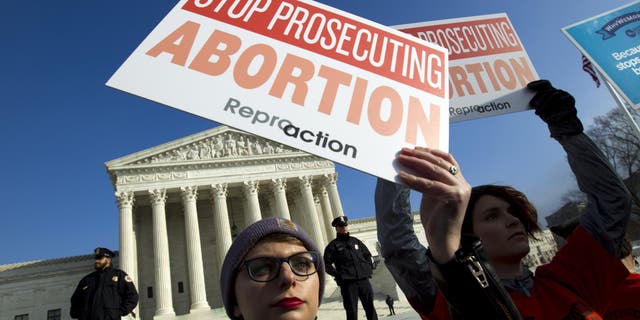 Abortion rights activists protest outside of the US Supreme Court