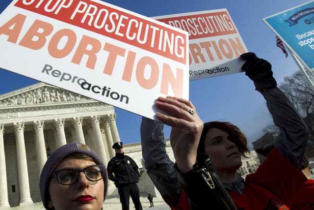 Abortion rights activists protest outside of the US Supreme Court