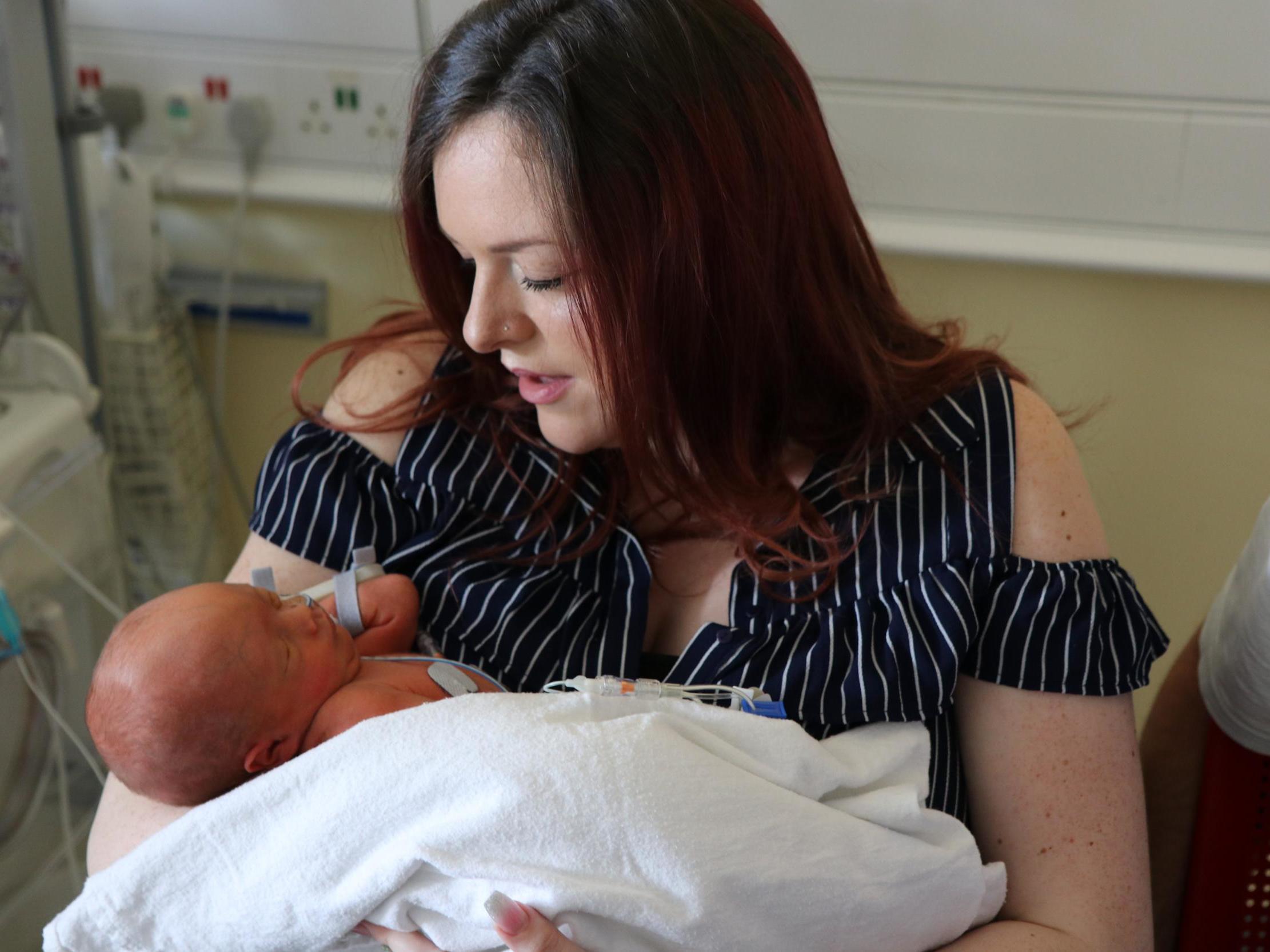 Sherrie Sharp, 28, and baby Jaxson underwent pioneering keyhole surgery while he was still in the womb