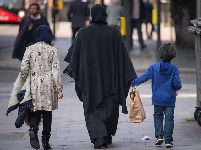 A general view of two Muslim women and a child in London