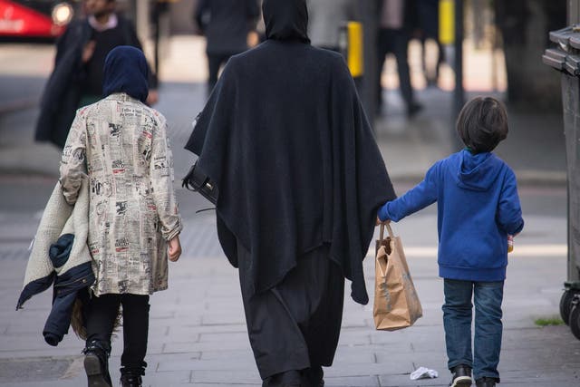 A general view of two Muslim women and a child in London