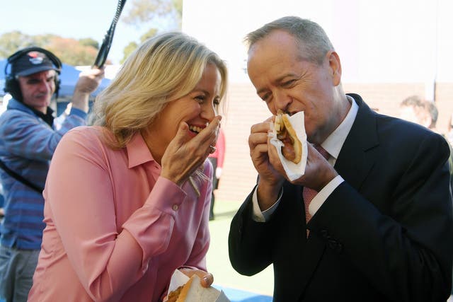 Australian Opposition Labor leader Bill Shorten and his wife Chloe eat democracy sausages.