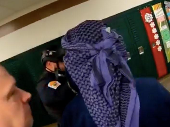 Actor seen in headscarf during school training exercise