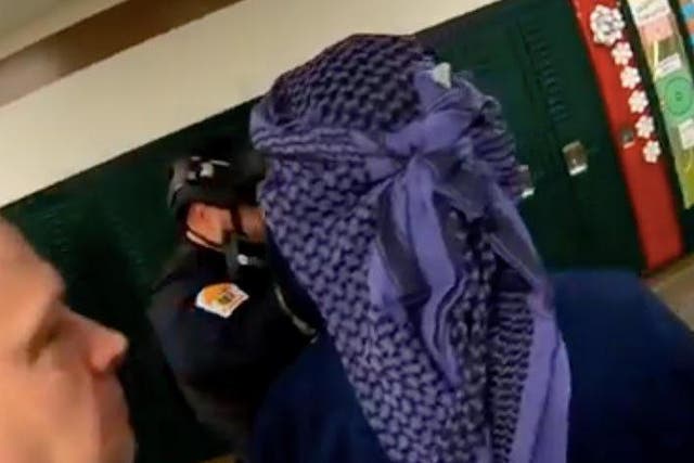 Actor seen in headscarf during school training exercise