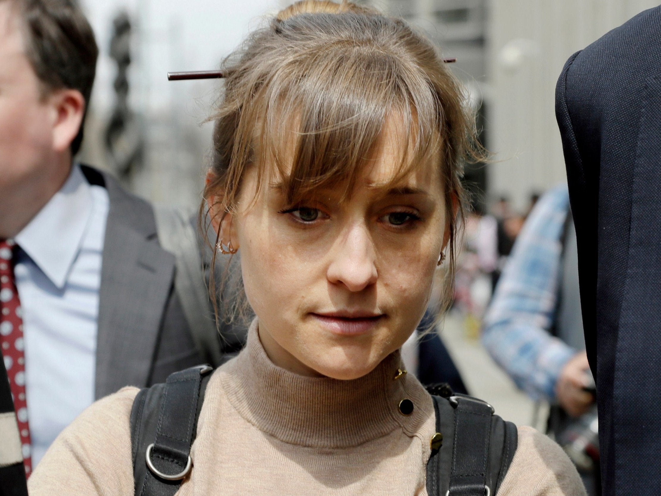 Actress Allison Mack leaves Brooklyn federal court after pleading guilty to racketeering charges