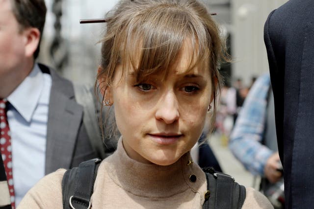 Actress Allison Mack leaves Brooklyn federal court in New York after pleading guilty to racketeering charges in a case involving a cult-like group based in upstate New York called NXIVM.