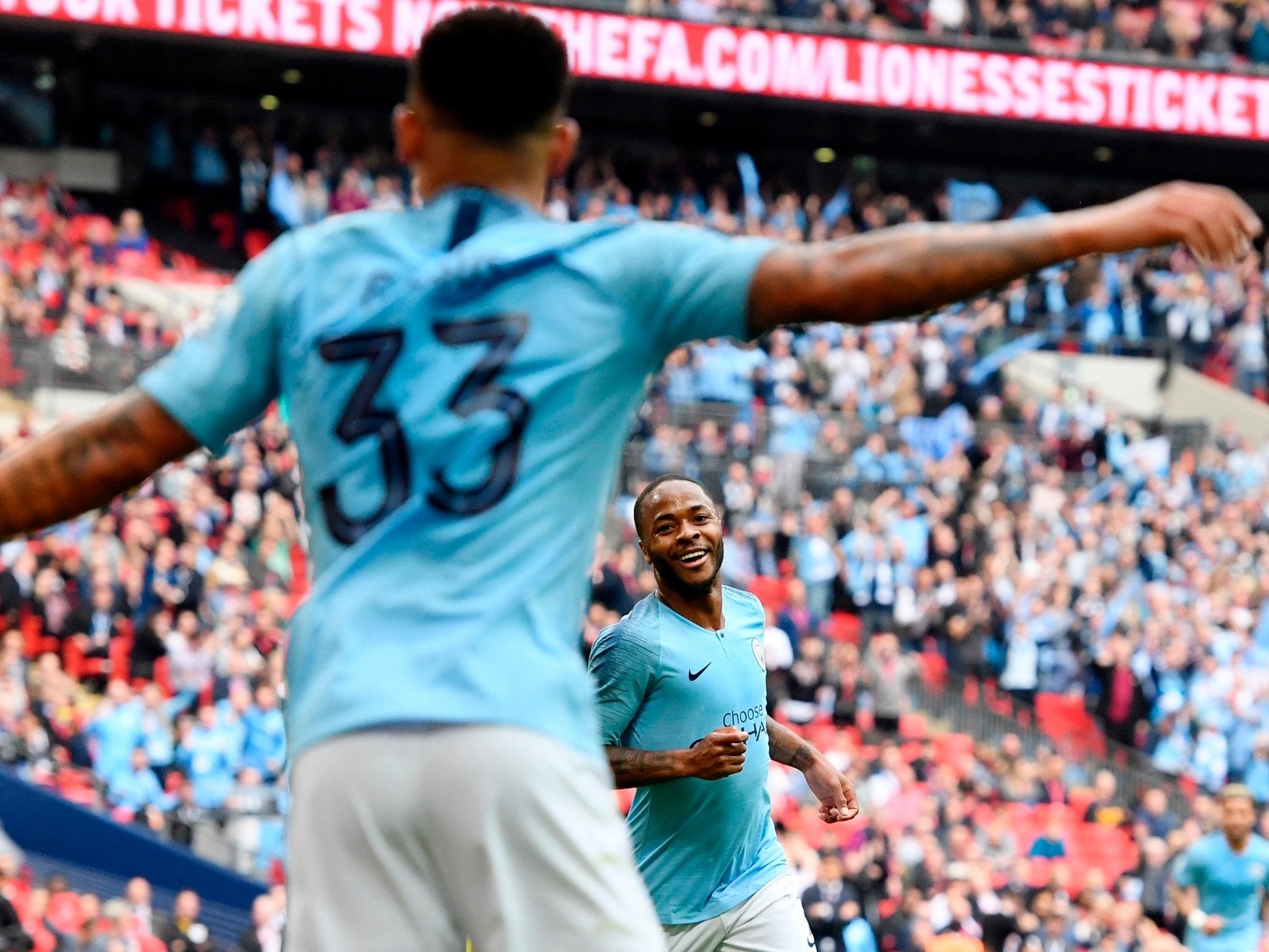 Raheem Sterling goes to celebrate with Gabriel Jesus