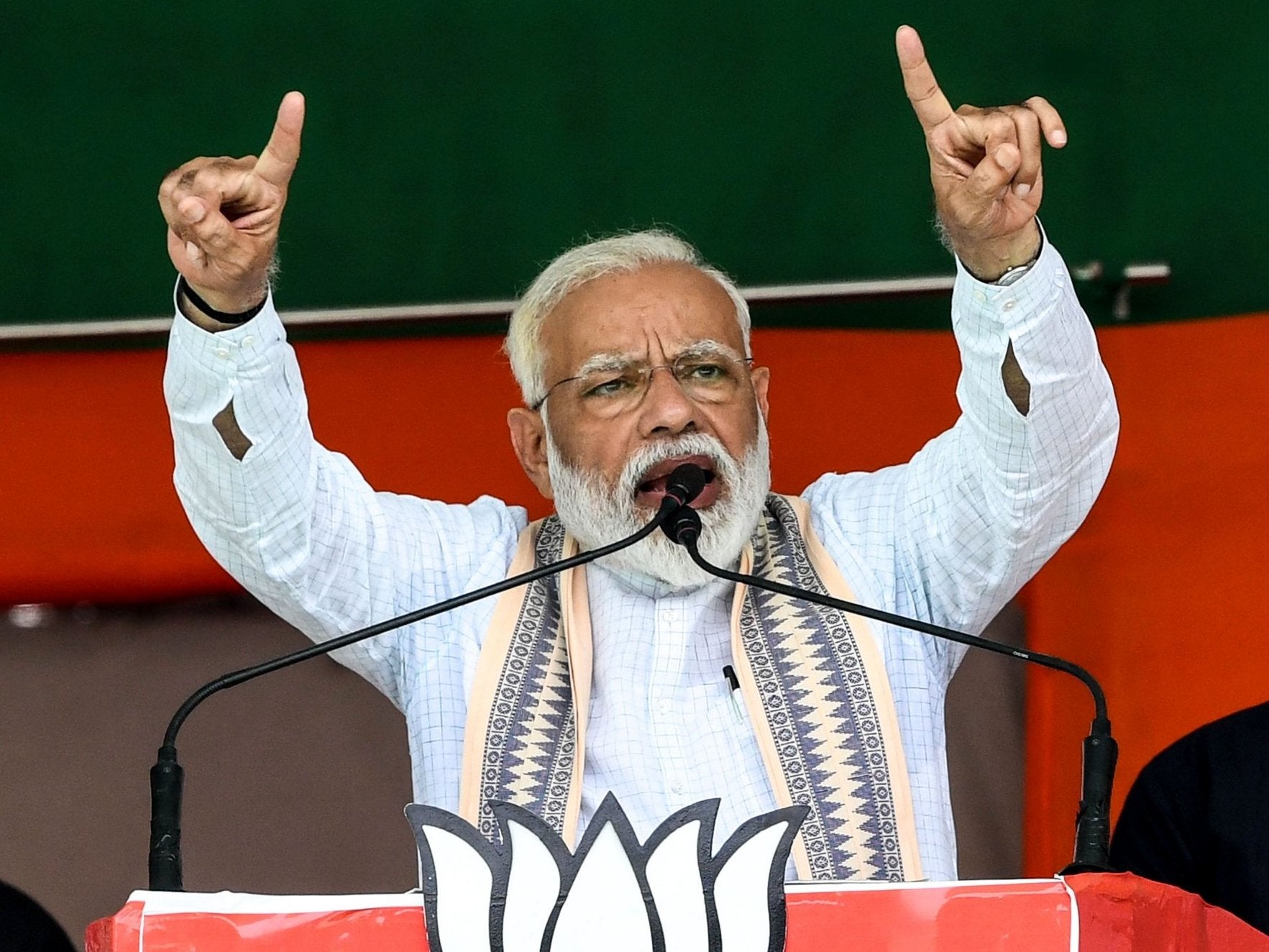 Indian Prime Minister Narendra Modi gestures as he speaks to political supporters during an election rally in Muzaffarpur in the eastern state of Bihar