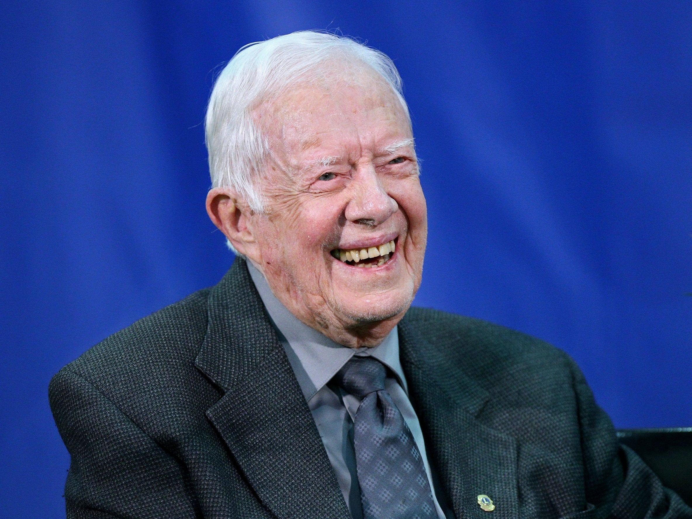Former President Jimmy Carter questioned whether Donald Trump was a legitimate president during a panel on human rights in Virginia on Friday.