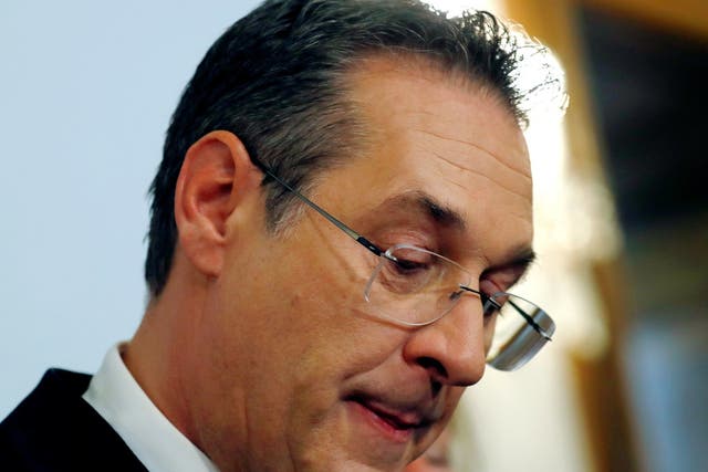 Austrian vice chancellor Heinz-Christian Strache reacts as he addresses the media in Vienna