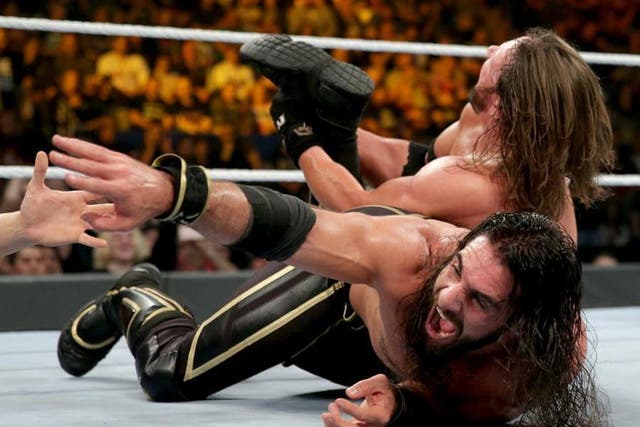 Seth Rollins looks to survive a calf crusher