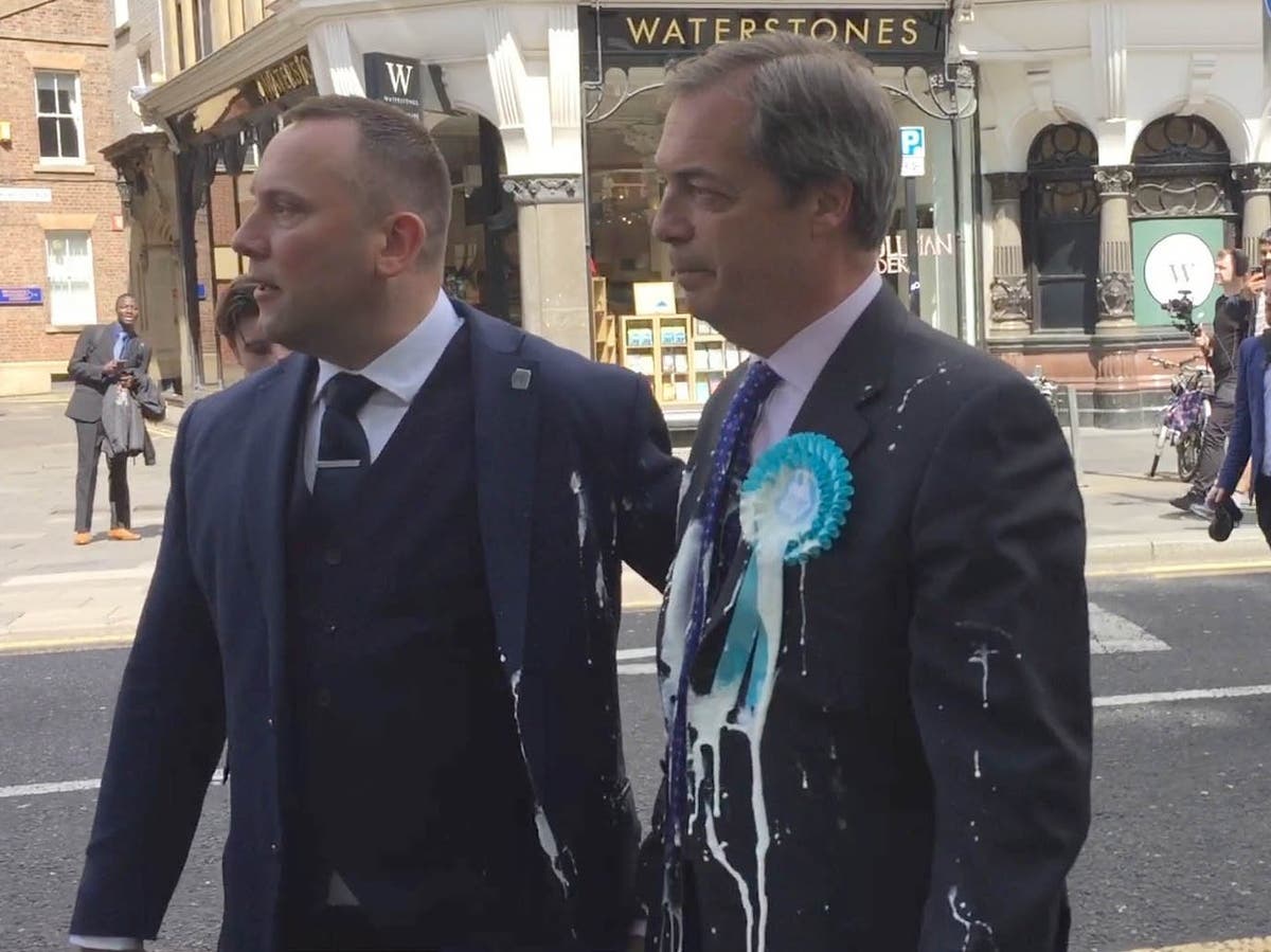 Nigel Farage 'trapped on bus' surrounded by protesters holding milkshakes