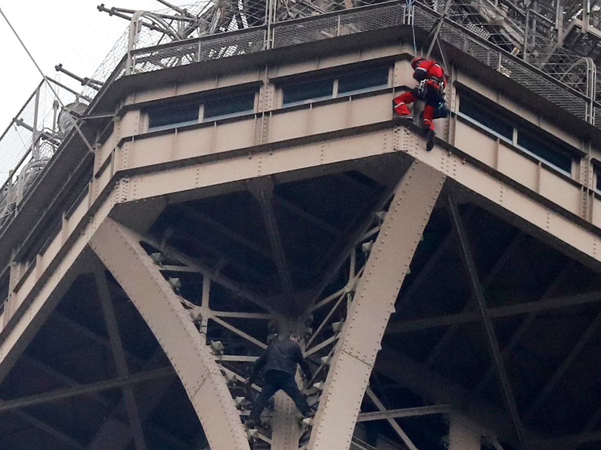Eiffel Tower shut down after man attempts to climb Paris monument The