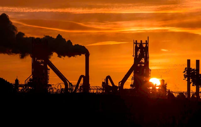 The sun rises behind the British Steel - Scunthorpe plant in north Lincolnshire, north east England