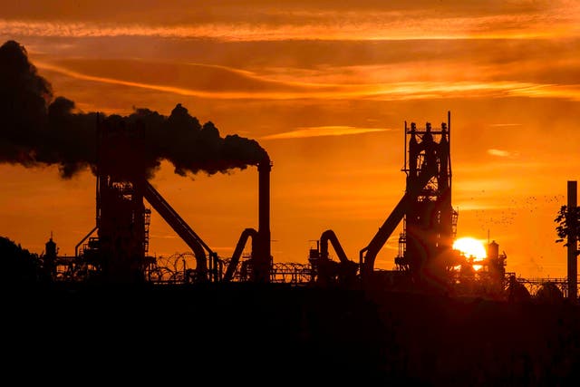 The sun rises behind the British Steel - Scunthorpe plant in north Lincolnshire, north east England