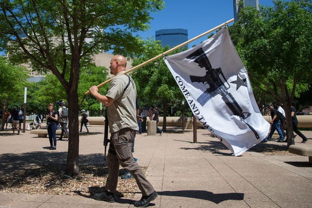 Gun advocate in Texas holds "come and take it" flag