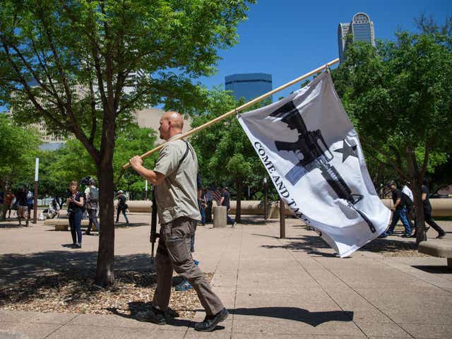 Gun advocate in Texas holds "come and take it" flag