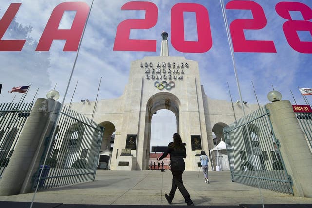 The torch is lit at the Los Angeles Coliseum after being named 2028 host
