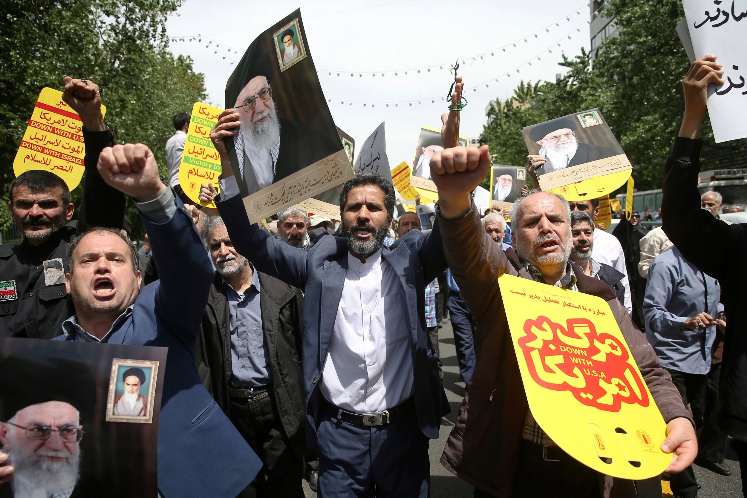 Worshippers chant slogans against the US and Israel during a rally in Tehran