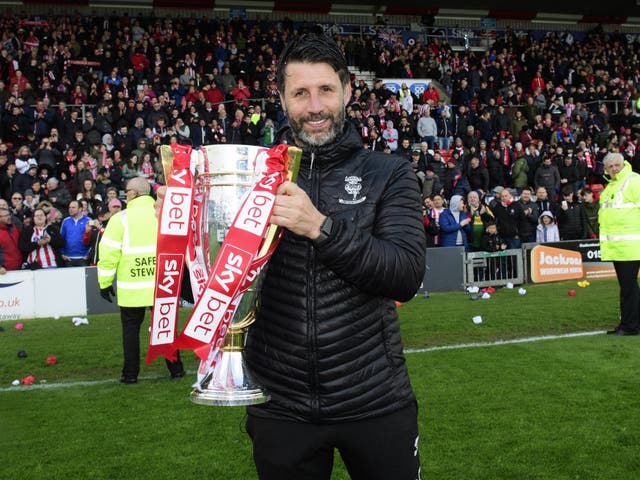 Danny Cowley celebrates with the League Two trophy