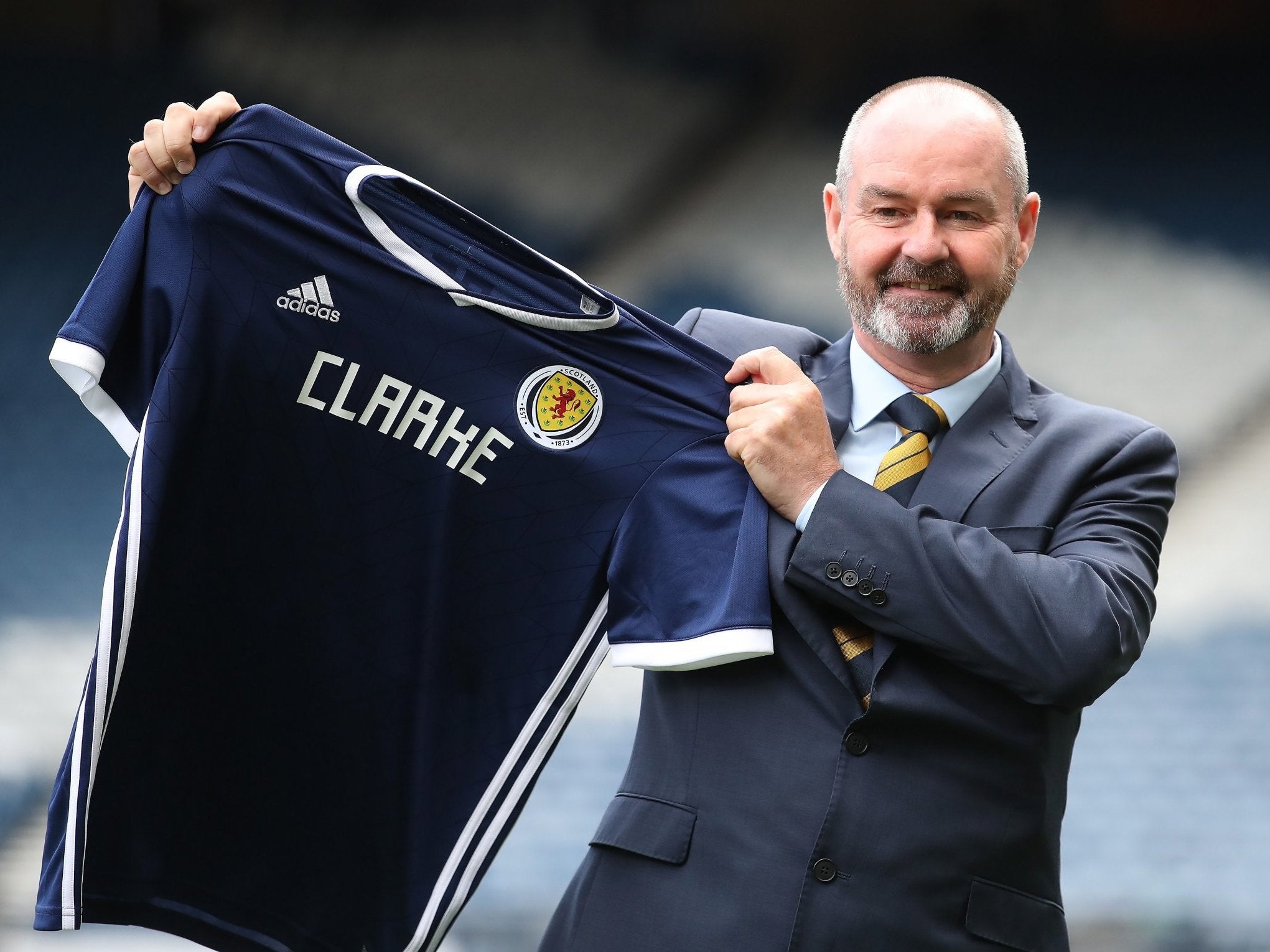 Steve Clarke poses with the Scotland international shirt