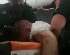 Passenger dragged off plane by police after locking himself in toilets