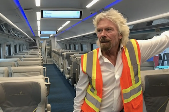 All aboard: passengers arriving at Orlando airport on Sir Richard Branson's airline will soon be able to travel on by train