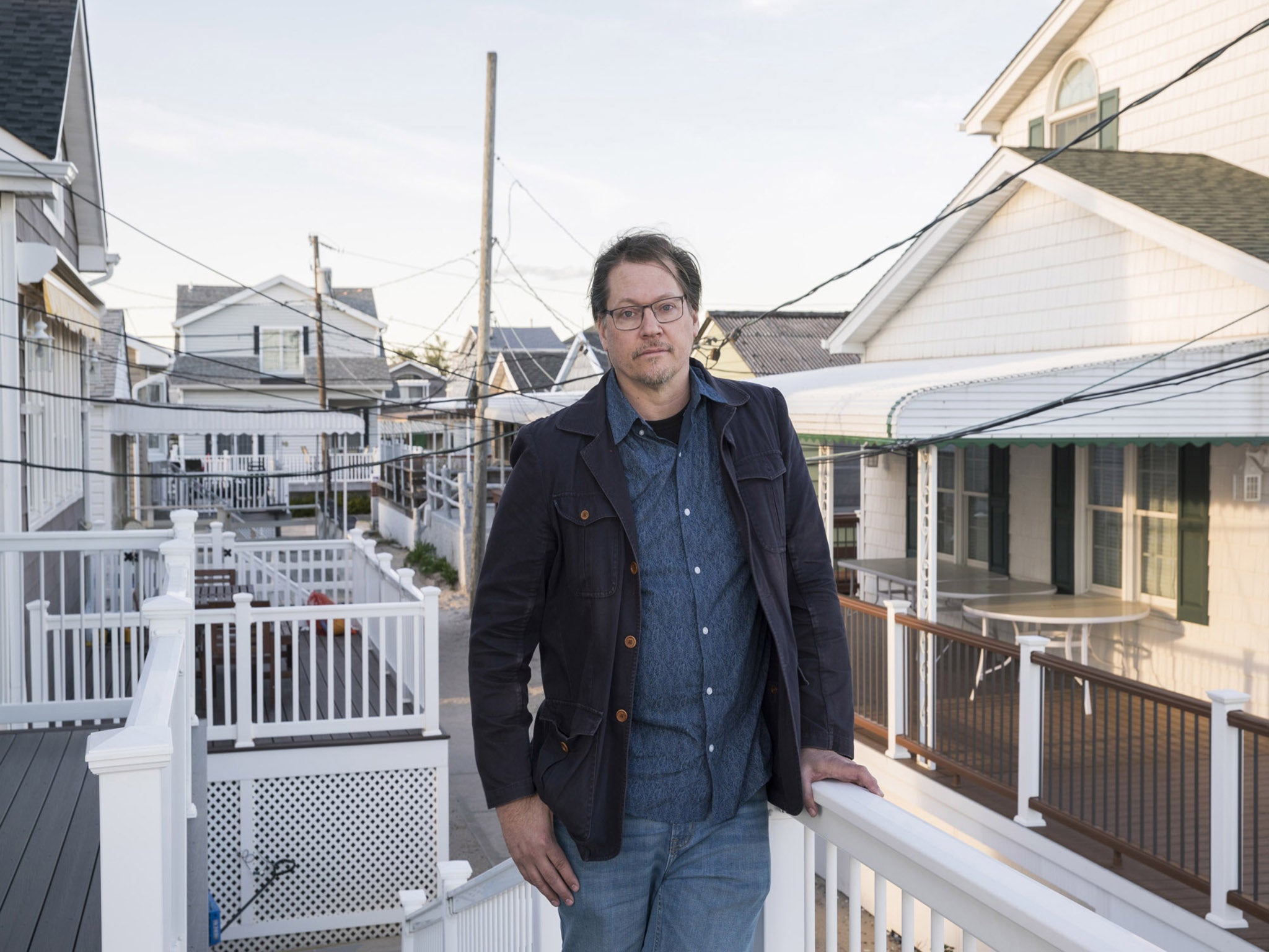Architect Illya Azaroff in front of a home his company designed in Breezy Point