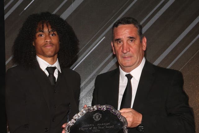 Ricky Spragia pictured presenting Tahith Chong with reserve player of the year award